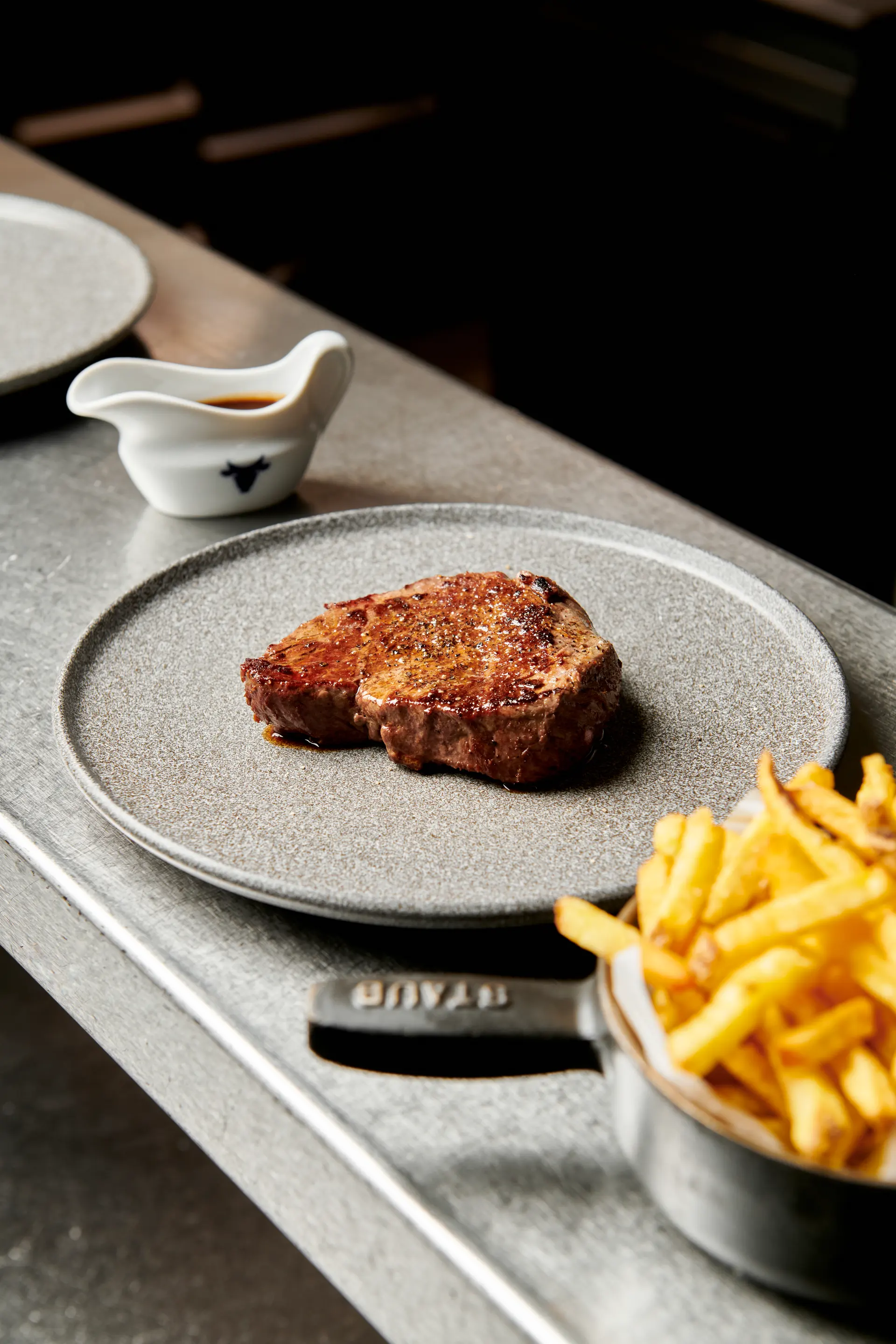 Beef steak from Čestr restaurant served with fries and sauce.